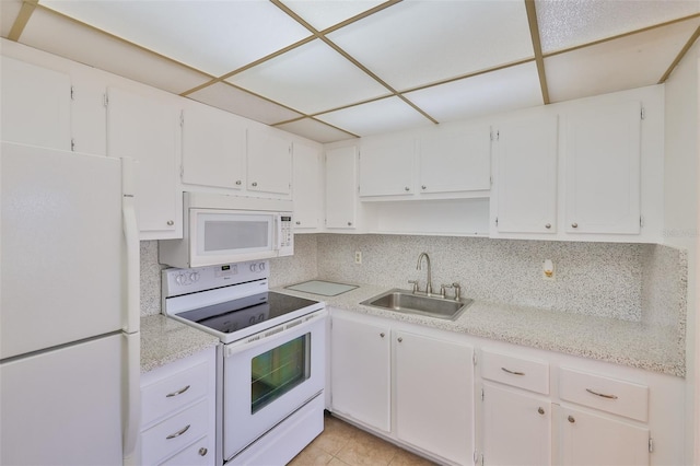 1802 Bedford Ter Unit 187, Sun City Center, FL 33573 - kitchen with white appliances, a sink, light countertops, white cabinets, and open shelves