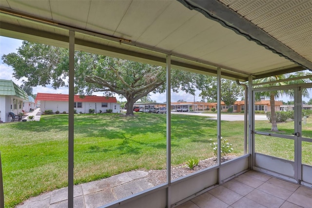 1802 Bedford Ter Unit 187, Sun City Center, FL 33573 - unfurnished sunroom featuring a residential view