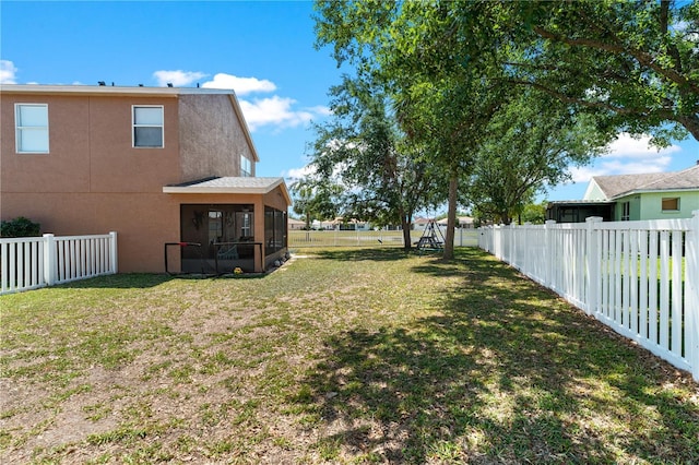 11449 Crestlake Village Dr, Riverview, FL 33569 - view of yard with a fenced backyard and a sunroom