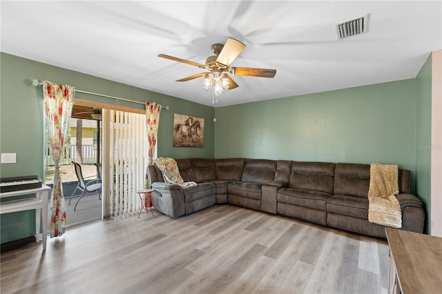 11449 Crestlake Village Dr, Riverview, FL 33569 - living area with ceiling fan, wood finished floors, and visible vents