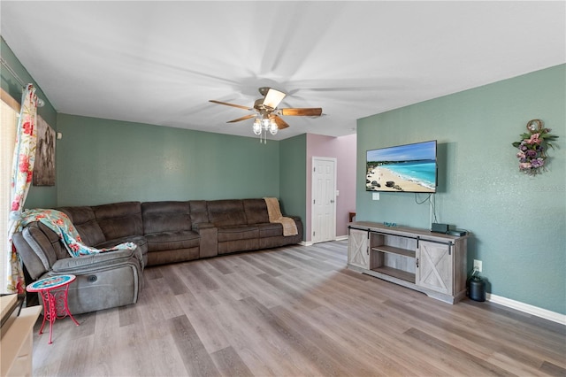 11449 Crestlake Village Dr, Riverview, FL 33569 - living room with ceiling fan, baseboards, and wood finished floors