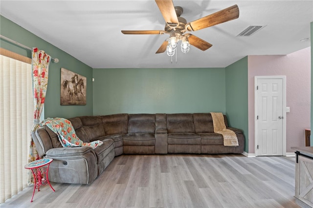 11449 Crestlake Village Dr, Riverview, FL 33569 - living room featuring a ceiling fan, visible vents, and light wood-style floors