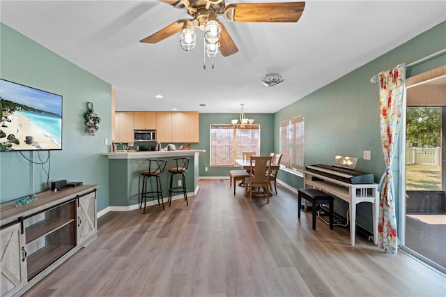 11449 Crestlake Village Dr, Riverview, FL 33569 - dining space featuring recessed lighting, light wood-type flooring, baseboards, and ceiling fan with notable chandelier