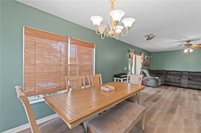 11449 Crestlake Village Dr, Riverview, FL 33569 - dining area featuring light wood-type flooring and ceiling fan with notable chandelier