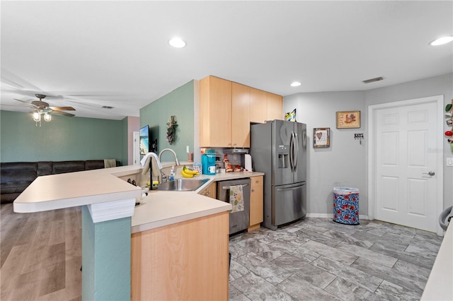 11449 Crestlake Village Dr, Riverview, FL 33569 - kitchen with light brown cabinetry, a ceiling fan, a sink, a peninsula, and appliances with stainless steel finishes