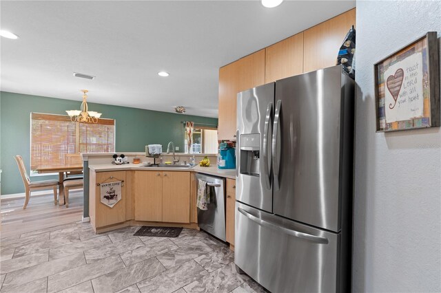 11449 Crestlake Village Dr, Riverview, FL 33569 - kitchen with light countertops, a sink, a peninsula, appliances with stainless steel finishes, and a notable chandelier