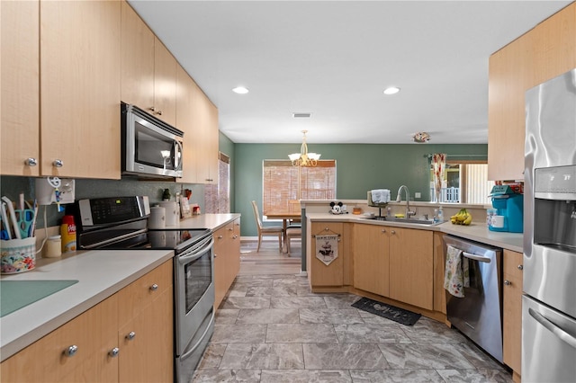 11449 Crestlake Village Dr, Riverview, FL 33569 - kitchen with light countertops, a peninsula, appliances with stainless steel finishes, and a sink