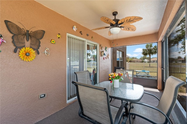 11449 Crestlake Village Dr, Riverview, FL 33569 - sunroom with outdoor dining area, carpet, and a ceiling fan
