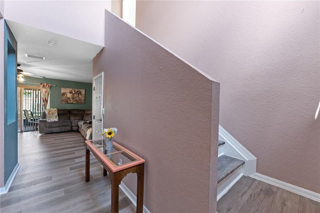 11449 Crestlake Village Dr, Riverview, FL 33569 - stairs with a textured wall, baseboards, a ceiling fan, and wood finished floors