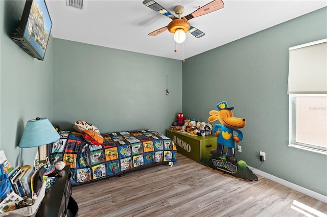 11449 Crestlake Village Dr, Riverview, FL 33569 - bedroom featuring wood finished floors, visible vents, a ceiling fan, and baseboards