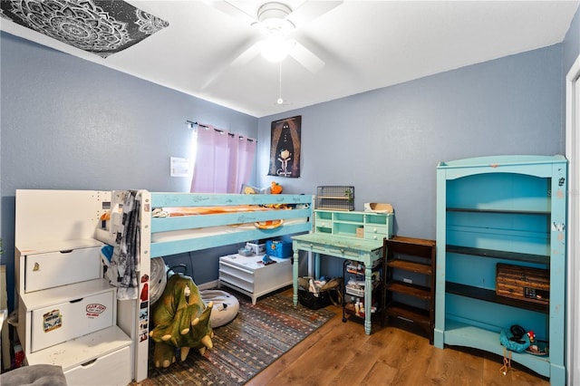 11449 Crestlake Village Dr, Riverview, FL 33569 - bedroom with a ceiling fan and wood finished floors