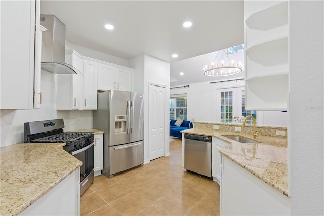 20121 Bending Creek Pl, Tampa, FL 33647 - kitchen with open shelves, wall chimney range hood, white cabinets, a sink, and stainless steel appliances