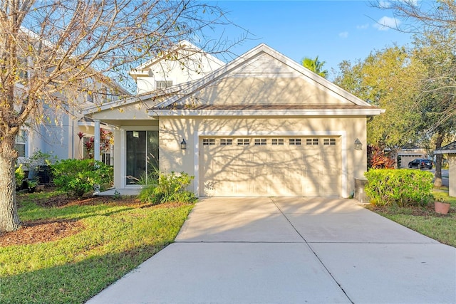 20121 Bending Creek Pl, Tampa, FL 33647 - view of front of property with stucco siding, an attached garage, and driveway