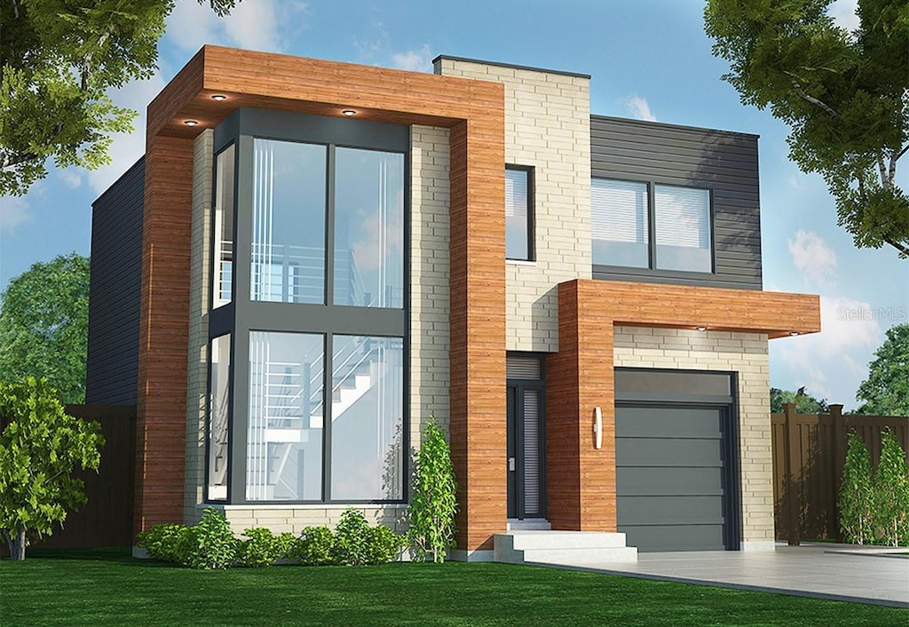 91 Avonwood, Tampa, FL 33625 - modern home with a front lawn, driveway, fence, and a garage