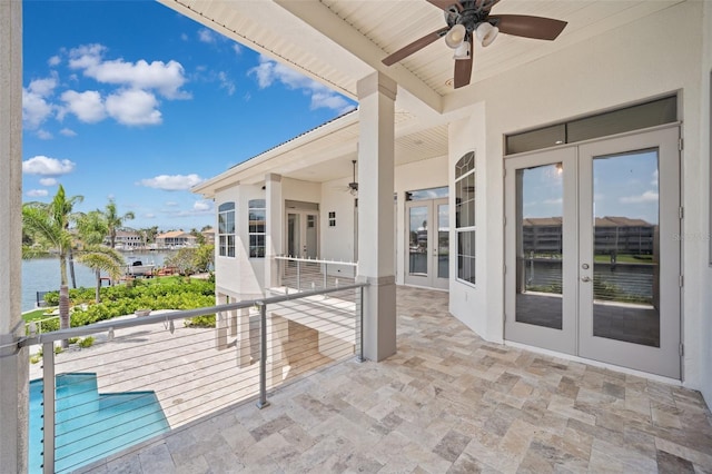 6202 Pasadena Point Blvd, Gulfport, FL 33707 - view of patio / terrace with french doors, a ceiling fan, and a water view