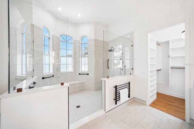 6202 Pasadena Point Blvd, Gulfport, FL 33707 - full bath with a walk in shower, a spacious closet, tile patterned floors, and recessed lighting