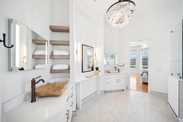 6202 Pasadena Point Blvd, Gulfport, FL 33707 - bathroom with vanity and a chandelier