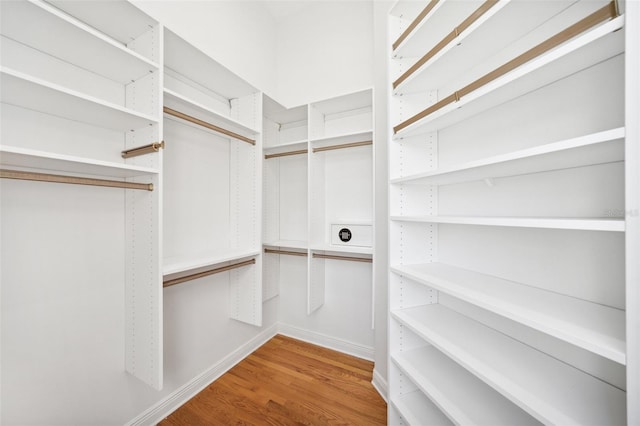 6202 Pasadena Point Blvd, Gulfport, FL 33707 - walk in closet featuring wood finished floors