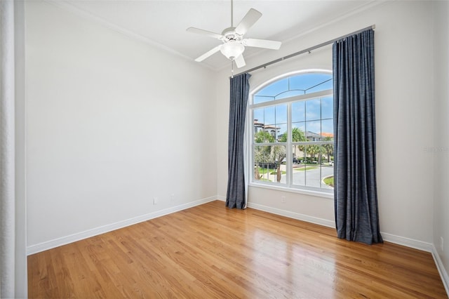 6202 Pasadena Point Blvd, Gulfport, FL 33707 - spare room with light wood-type flooring, crown molding, baseboards, and a ceiling fan