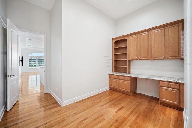 6202 Pasadena Point Blvd, Gulfport, FL 33707 - unfurnished office with built in desk, light wood-style flooring, and baseboards