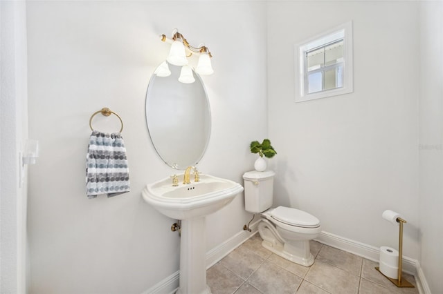 6202 Pasadena Point Blvd, Gulfport, FL 33707 - half bath featuring tile patterned flooring, baseboards, and toilet