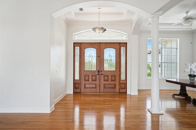 6202 Pasadena Point Blvd, Gulfport, FL 33707 - entrance foyer featuring wood finished floors, crown molding, a raised ceiling, baseboards, and ceiling fan