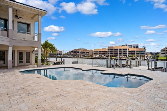 6202 Pasadena Point Blvd, Gulfport, FL 33707 - outdoor pool featuring french doors, a patio, ceiling fan, and a water view