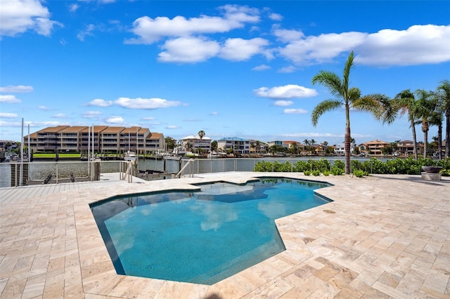 6202 Pasadena Point Blvd, Gulfport, FL 33707 - swimming pool with a water view, a patio area, and a hot tub