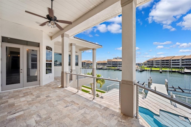 6202 Pasadena Point Blvd, Gulfport, FL 33707 - view of patio featuring a water view, french doors, a ceiling fan, and a balcony