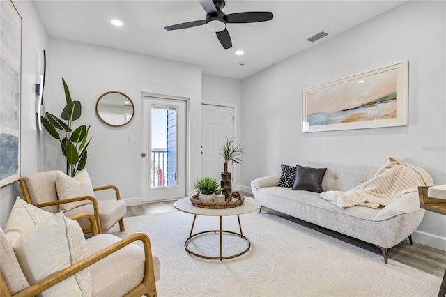 13117 4th St E, Madeira Beach, FL 33708 - living room with wood finished floors, baseboards, recessed lighting, and a ceiling fan