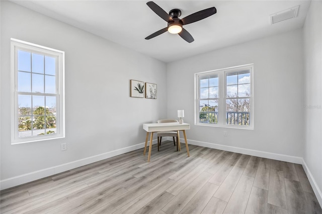 13117 4th St E, Madeira Beach, FL 33708 - home office featuring light wood-style flooring, baseboards, and a ceiling fan