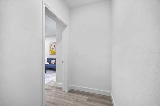 13117 4th St E, Madeira Beach, FL 33708 - hall featuring light wood-style floors and baseboards