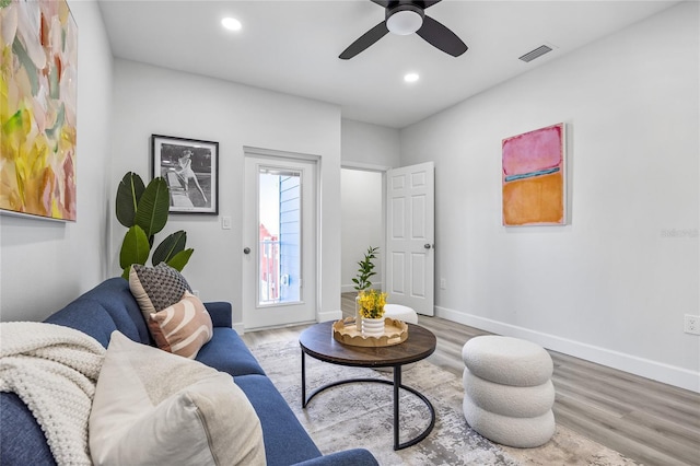 13117 4th St E, Madeira Beach, FL 33708 - living area with wood finished floors, recessed lighting, ceiling fan, and baseboards