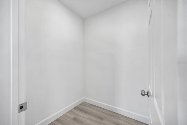 13117 4th St E, Madeira Beach, FL 33708 - laundry room featuring baseboards and light wood-type flooring