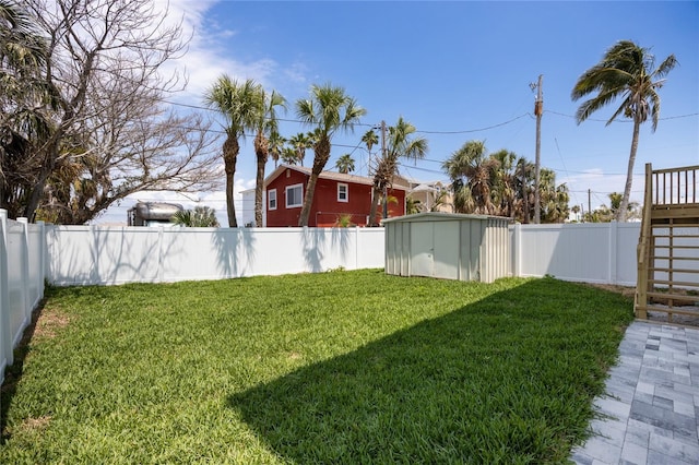 13117 4th St E, Madeira Beach, FL 33708 - view of yard with a storage unit and an outbuilding