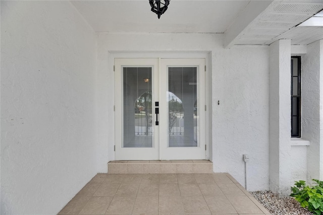 927 Golf Island Dr, Apollo Beach, FL 33572 - doorway to property featuring stucco siding and french doors