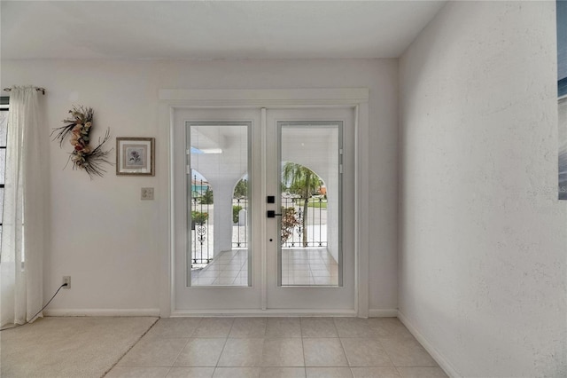 927 Golf Island Dr, Apollo Beach, FL 33572 - entryway featuring light tile patterned flooring and baseboards