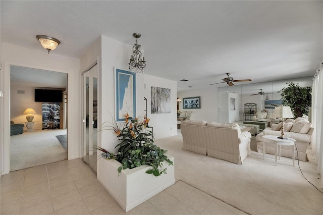 927 Golf Island Dr, Apollo Beach, FL 33572 - living area featuring light carpet, light tile patterned flooring, and ceiling fan