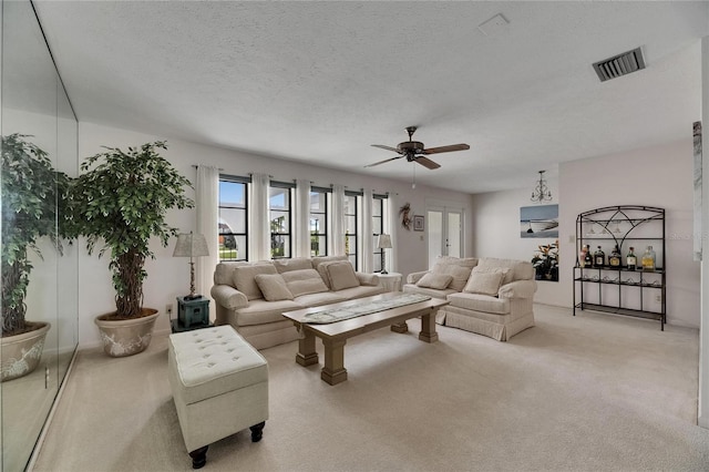 927 Golf Island Dr, Apollo Beach, FL 33572 - carpeted living room featuring a ceiling fan and a textured ceiling