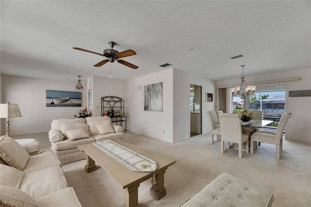 927 Golf Island Dr, Apollo Beach, FL 33572 - living room with a chandelier, a textured ceiling, light carpet, and a ceiling fan