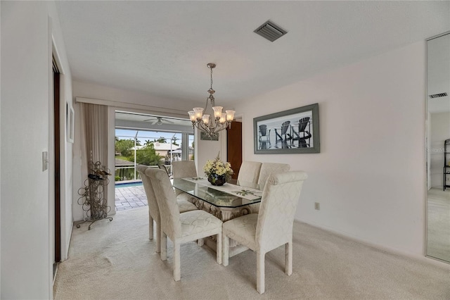 927 Golf Island Dr, Apollo Beach, FL 33572 - dining room featuring light carpet and a chandelier