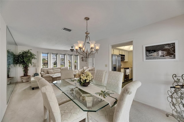 927 Golf Island Dr, Apollo Beach, FL 33572 - dining area featuring a chandelier, light carpet, and baseboards