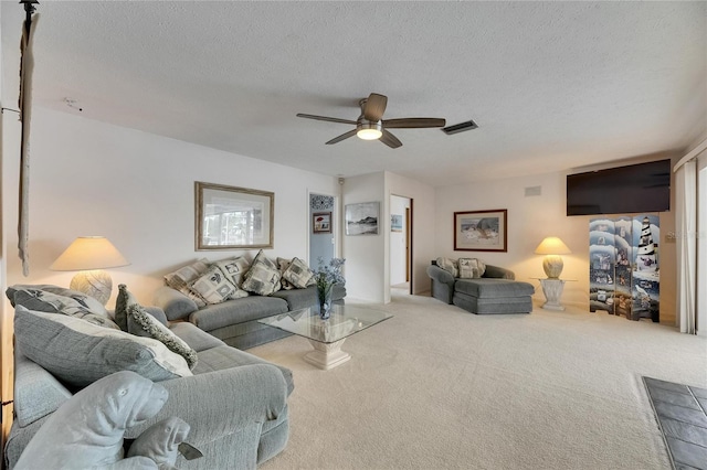 927 Golf Island Dr, Apollo Beach, FL 33572 - living room featuring ceiling fan, carpet flooring, and a textured ceiling