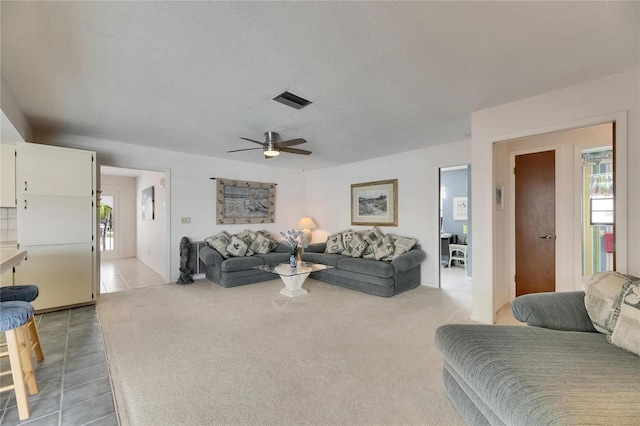 927 Golf Island Dr, Apollo Beach, FL 33572 - living area with ceiling fan, light tile patterned flooring, and a textured ceiling