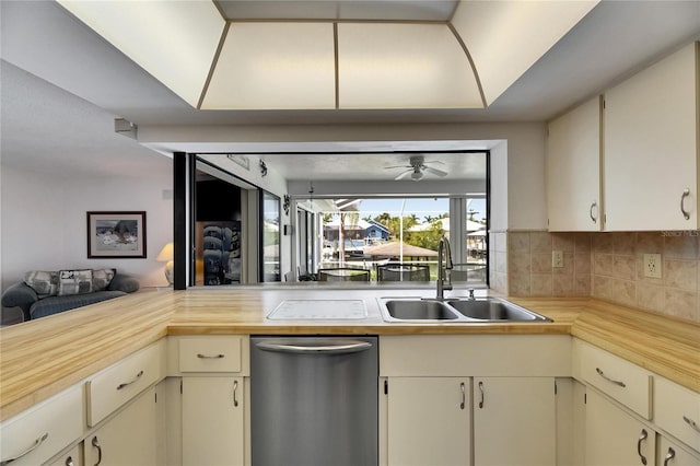 927 Golf Island Dr, Apollo Beach, FL 33572 - kitchen featuring a sink, dishwasher, decorative backsplash, a ceiling fan, and butcher block counters