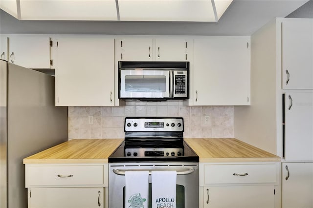 927 Golf Island Dr, Apollo Beach, FL 33572 - kitchen featuring stainless steel appliances, light countertops, and decorative backsplash