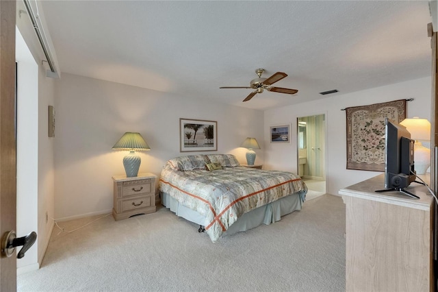 927 Golf Island Dr, Apollo Beach, FL 33572 - bedroom with light colored carpet, ceiling fan, baseboards, and connected bathroom