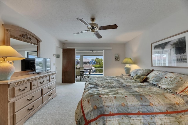 927 Golf Island Dr, Apollo Beach, FL 33572 - bedroom with access to exterior, carpet, a textured ceiling, and ceiling fan