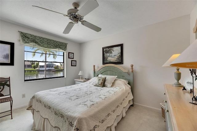 927 Golf Island Dr, Apollo Beach, FL 33572 - bedroom featuring light colored carpet, baseboards, and ceiling fan