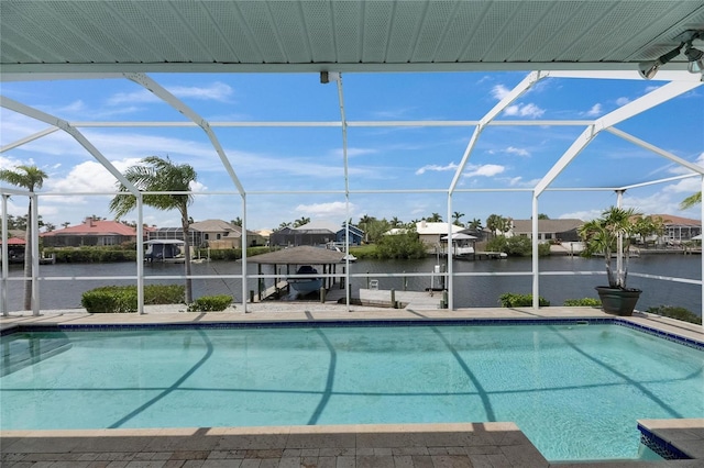 927 Golf Island Dr, Apollo Beach, FL 33572 - swimming pool featuring a lanai, boat lift, a boat dock, a water view, and a residential view